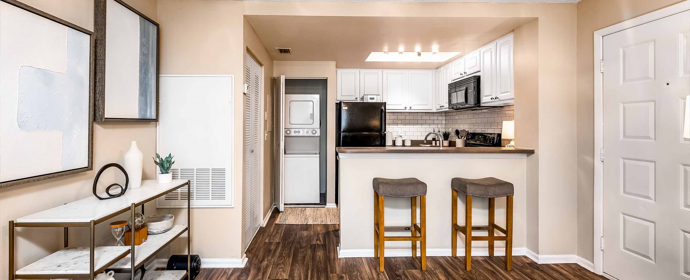 kitchen, laundry and living room at The Meridian Apartments
